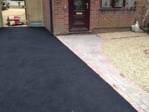 tarmac driveways in Bedworth carried out last year - image shows new driveway we laid next to a block paved pathway and small front garden